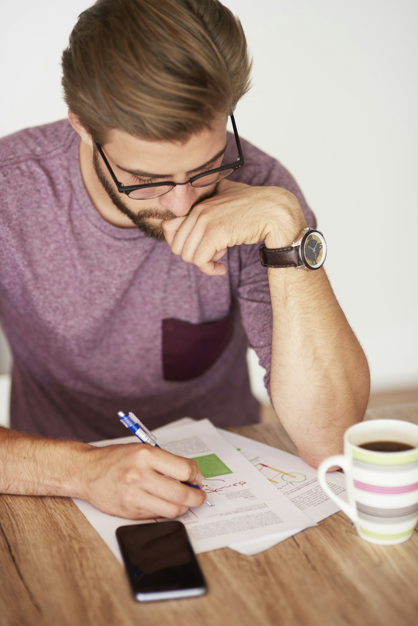 high angle view on man working over documents